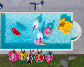 friends having fun in a swimming pool 2025 03 16 21 04 43 utc scaled e1763152931318